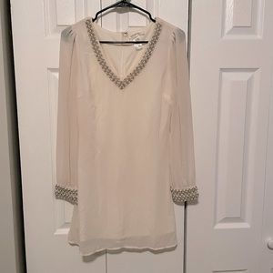 White chiffon dress with beaded neck and cuffs